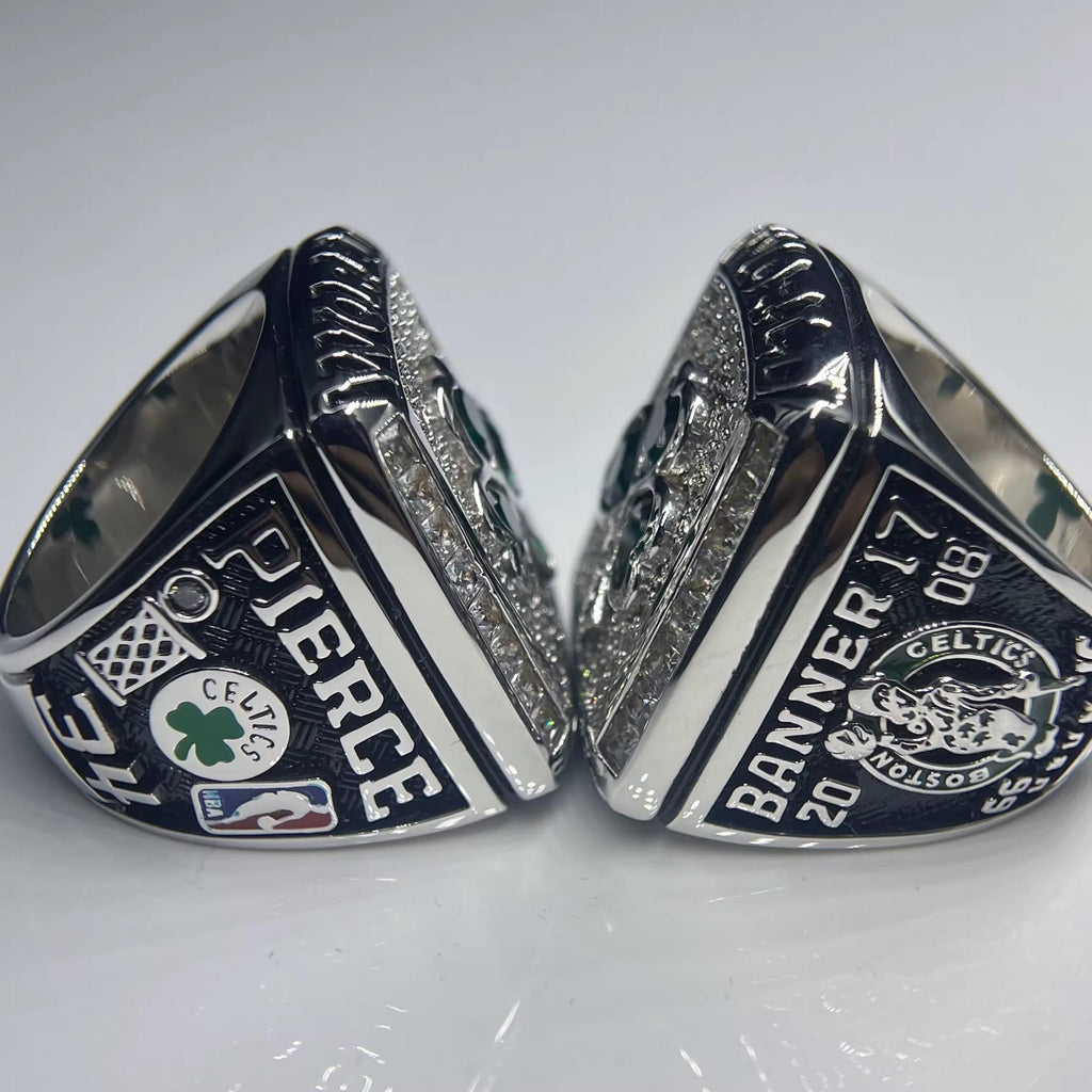 Two silver rings with engravings on a white background
