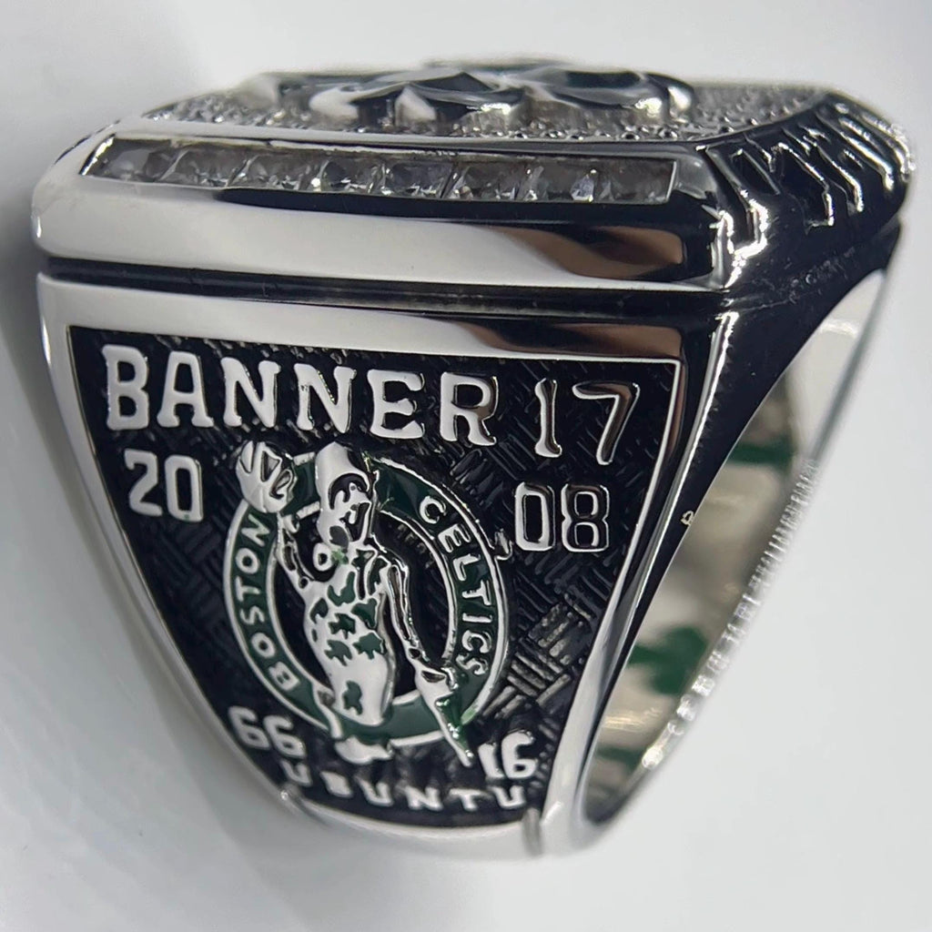 Silver ring with 'Banner 17' and '2008' engraving on a white background