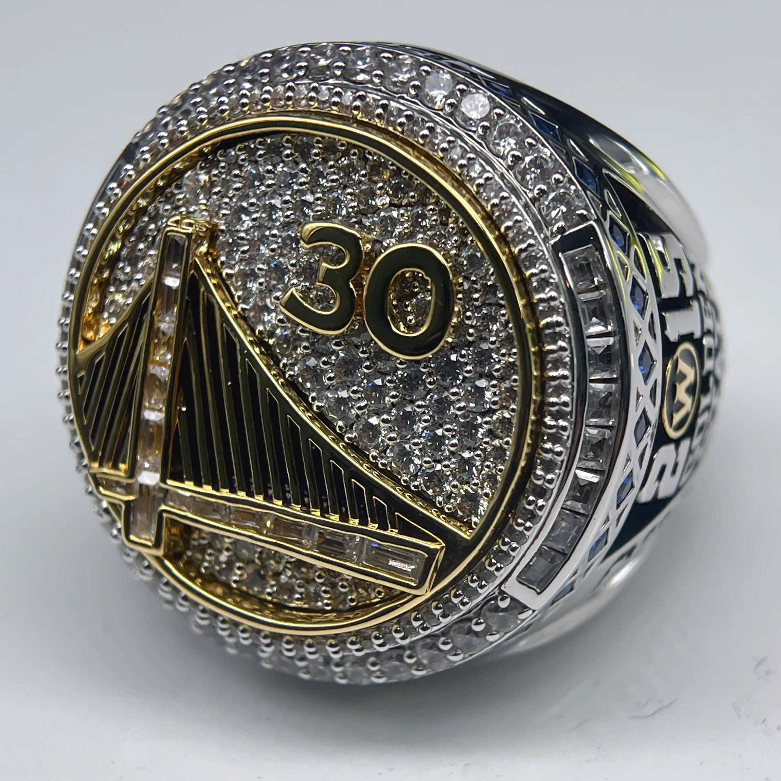 Ring with '30' and Golden Gate Bridge design on a white background