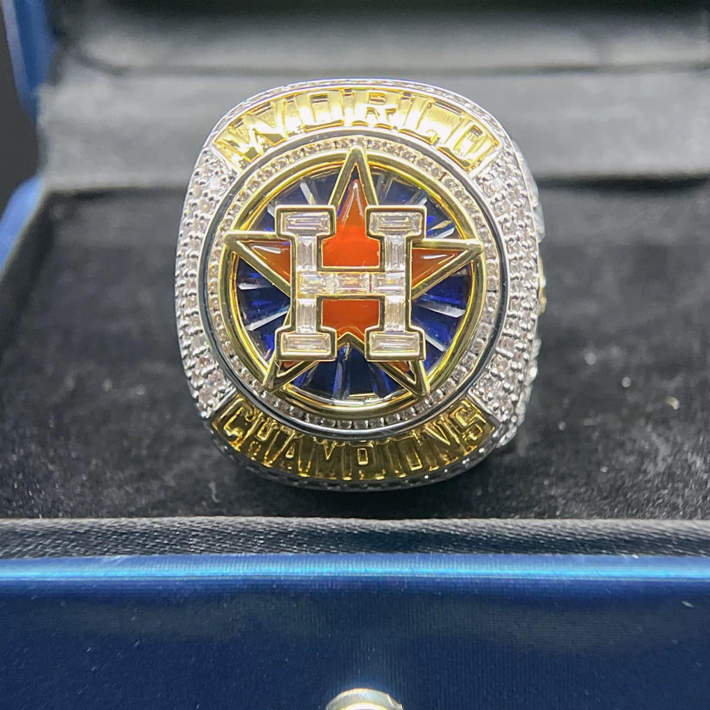 World Series championship ring with star design on a black surface