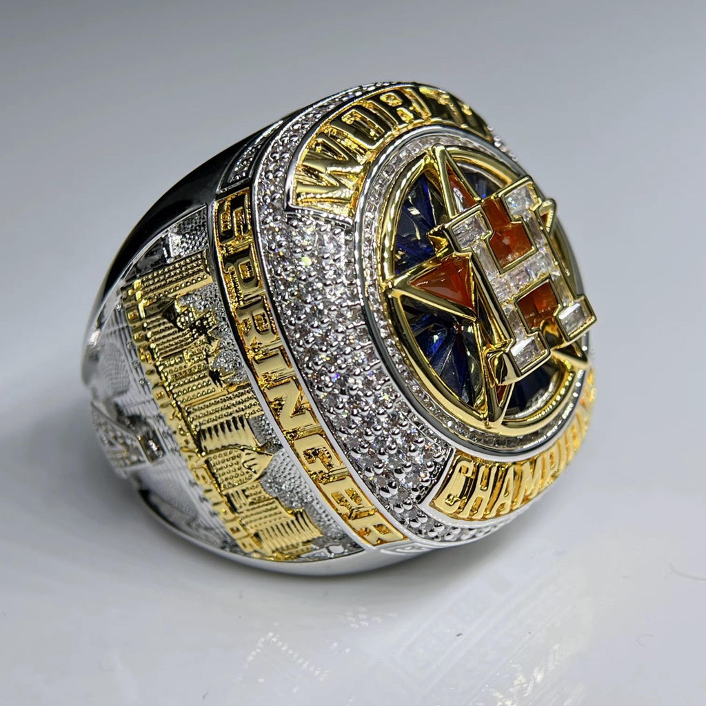 Luxury ring with gold and silver design on a gray background