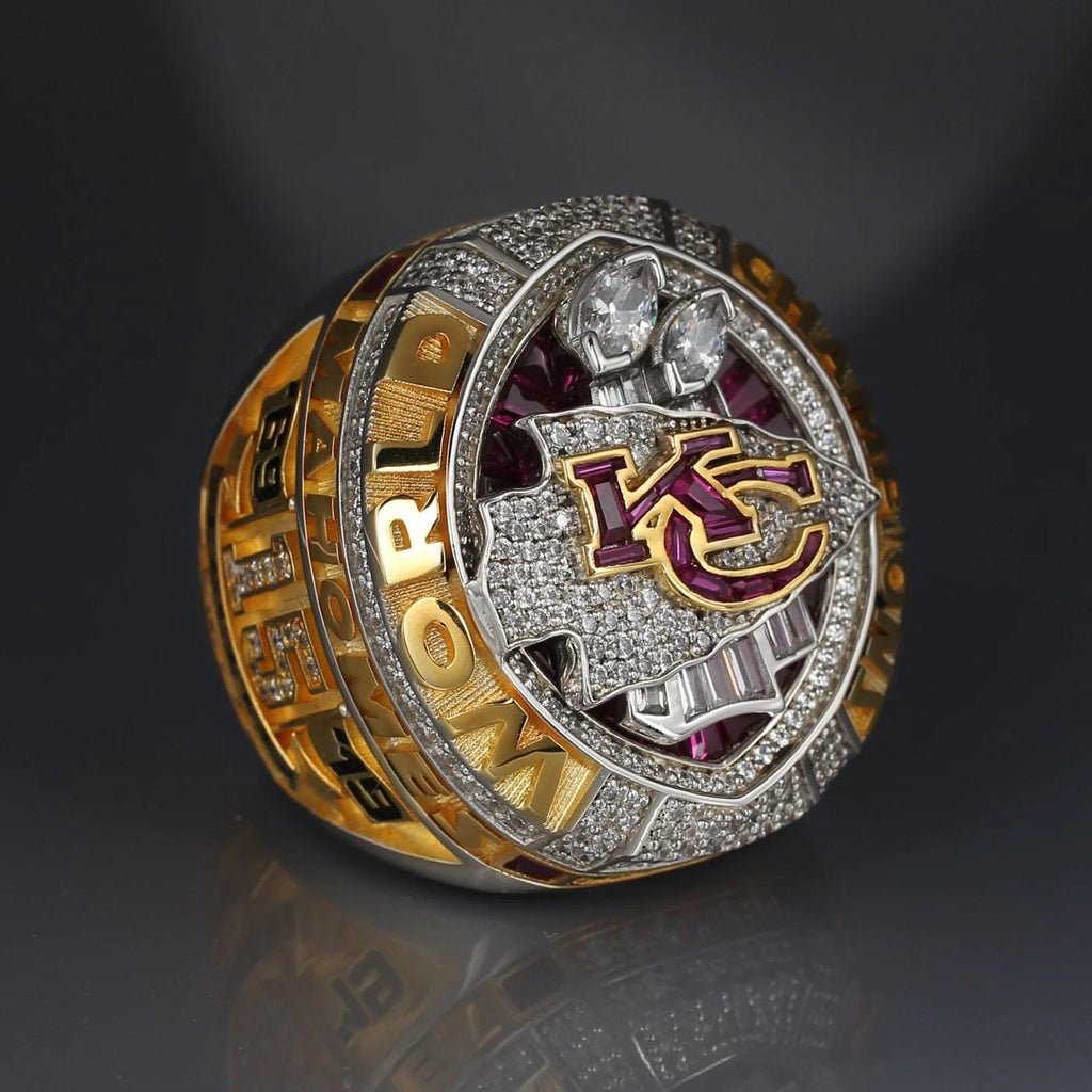 Luxury sports ring with 'KC' logo on a dark background