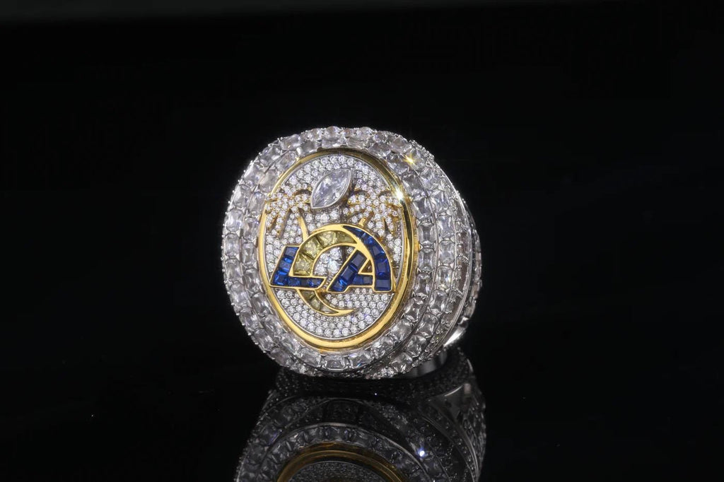 Luxury ring with diamond-studded band and emblem on a black background