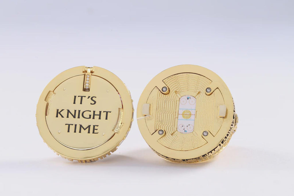 Gold ring with 'It's Knight Time' engraving on a white background