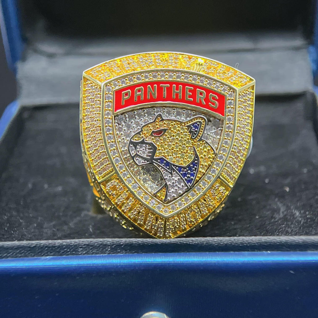 Gold and red emblem with panther design and 'PANTHERS' text on a black background