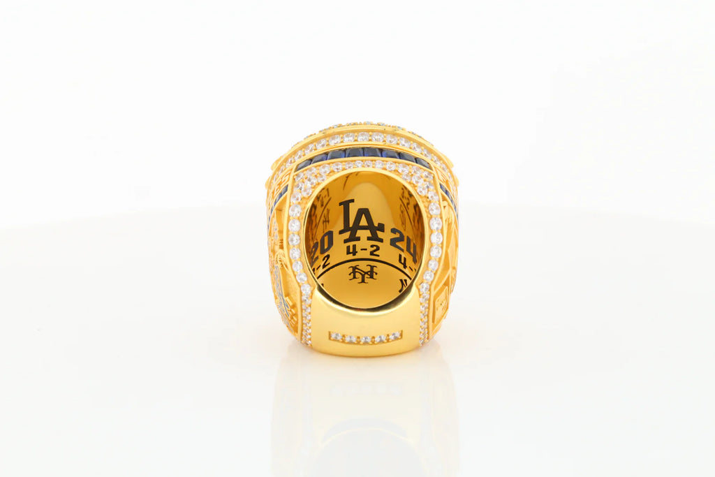 Gold sports championship ring with 'LA' and number '20' on a white background
