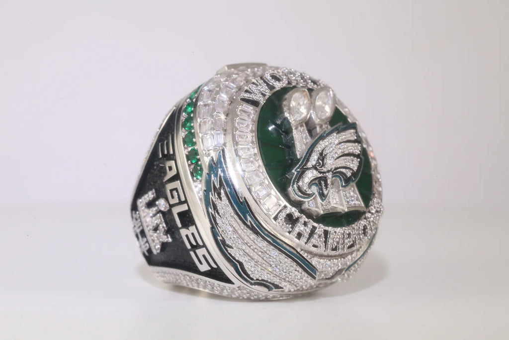 Silver championship ring with 'Eagles' branding on a white background