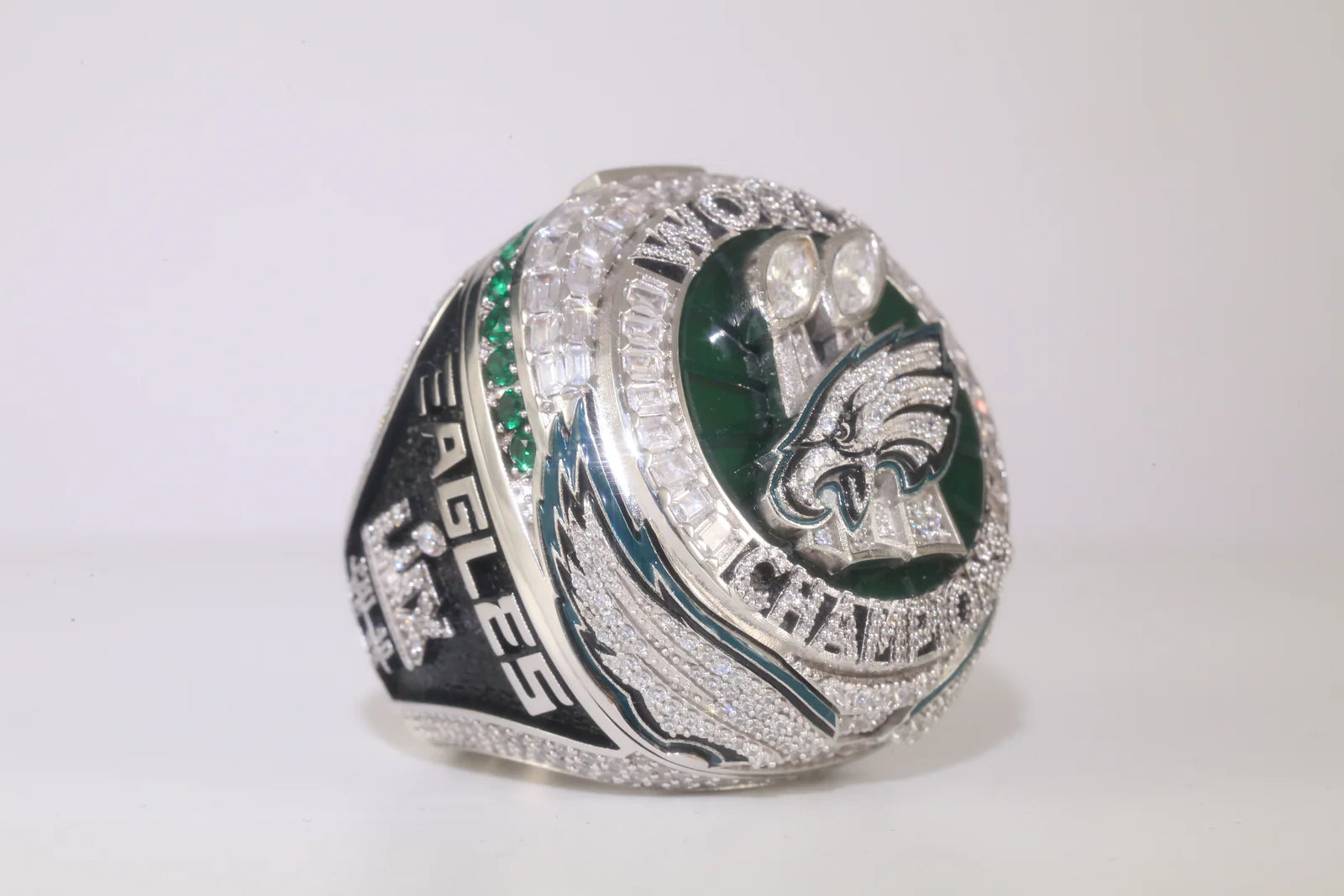 Silver championship ring with 'Eagles' branding on a white background