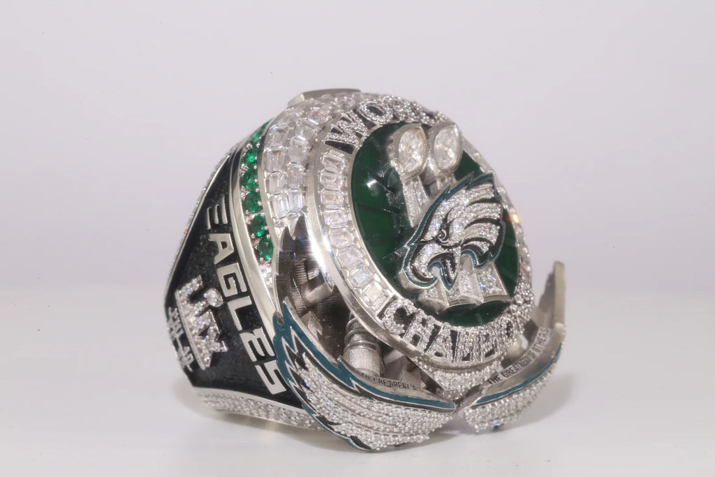 Silver championship ring with 'Eagles' text and logo on a white background
