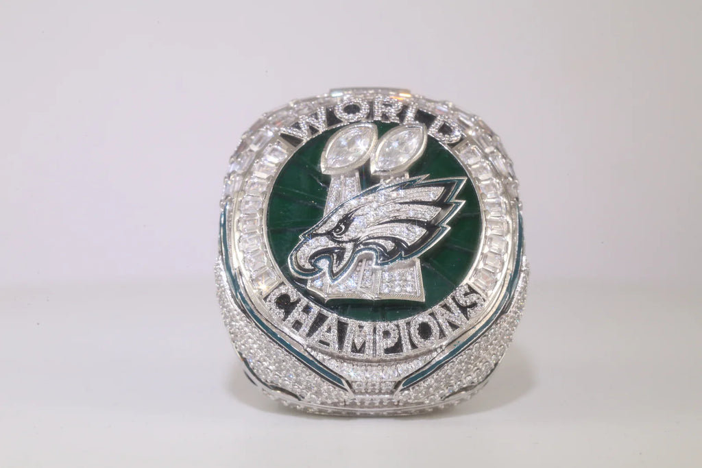 Super Bowl championship ring with Philadelphia Eagles logo on a white background