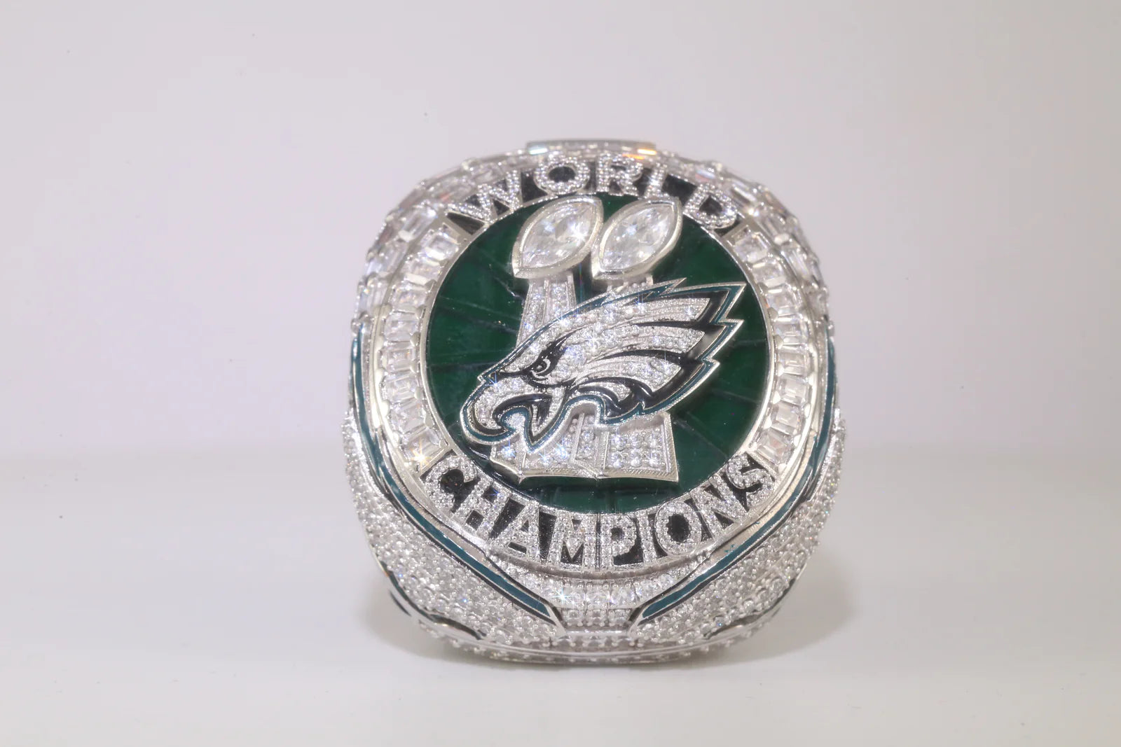 Super Bowl championship ring with Philadelphia Eagles logo on a white background