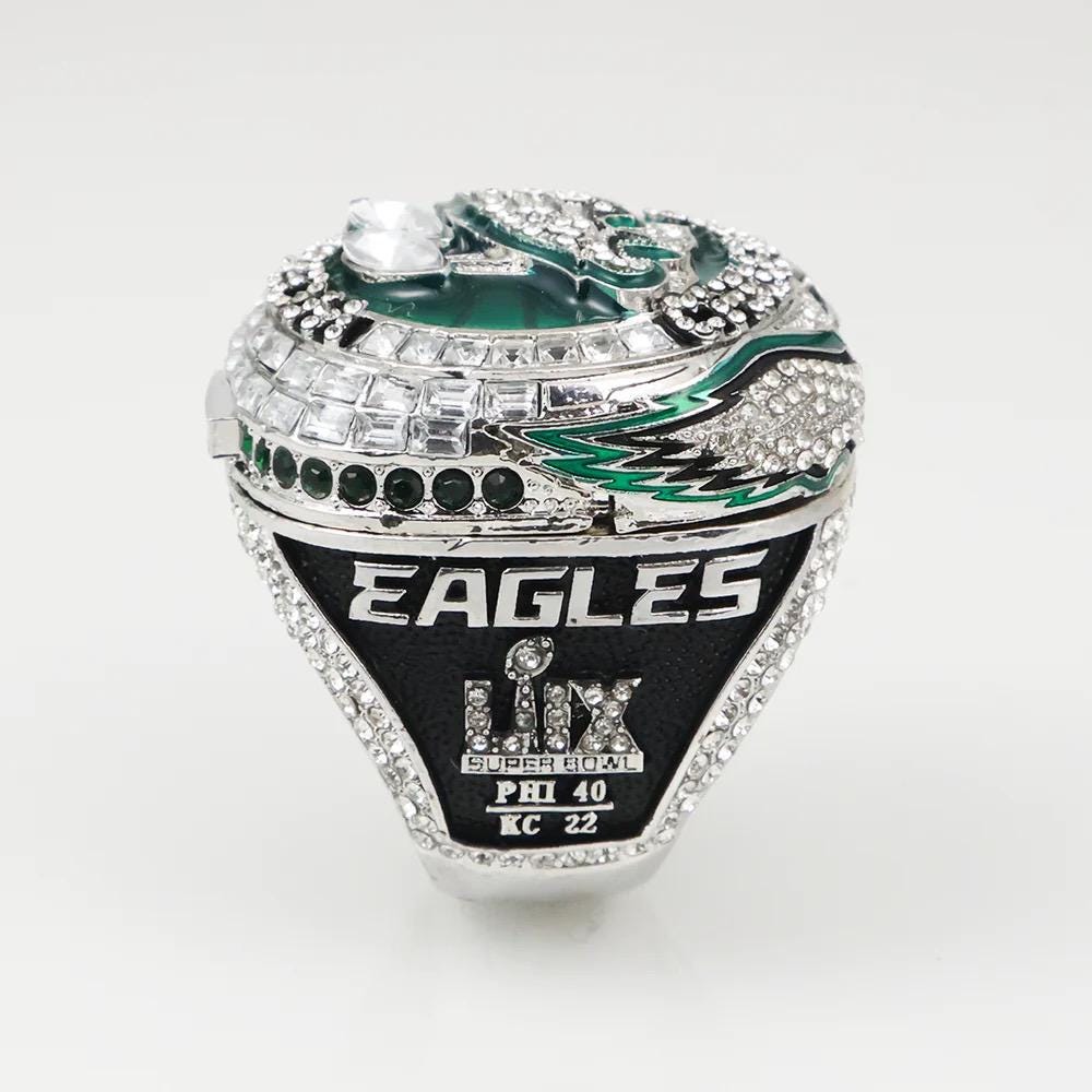 Silver championship ring with 'Eagles' and Super Bowl LIX branding on a white background