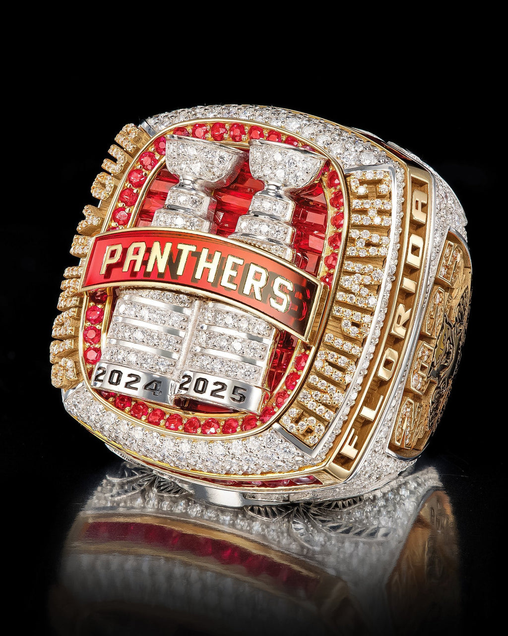 Florida Panthers championship ring with red and gold details on a black background