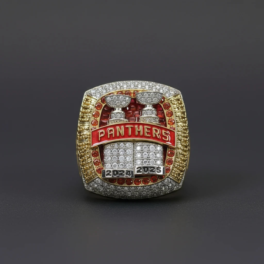 Panthers championship ring with red and gold colors on a textured surface
