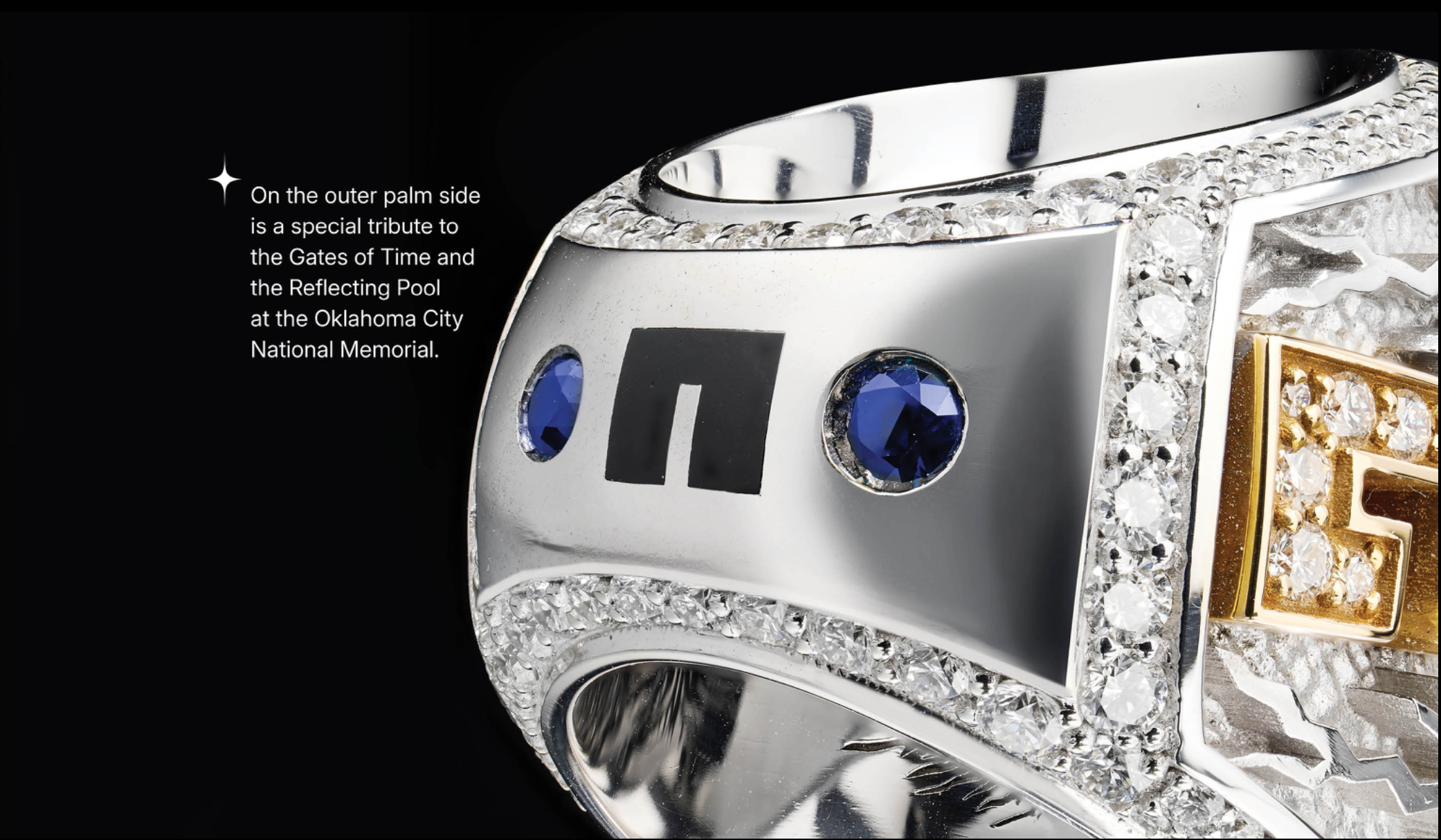 Silver ring with blue gemstones and gold accents on a black background